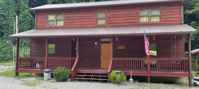 3BR 2 Bath house with full kitchen, living room, and hot tub.