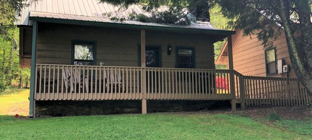 Bear Cave Cabin is perched on a hilltop overlooking Valley Springs lake