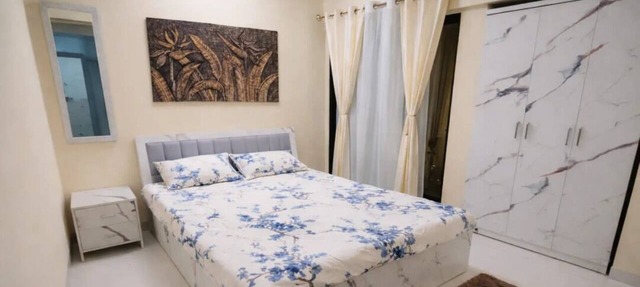 Bright balcony 2-bedroom apartment with AC in vibrant Thane/Mulund