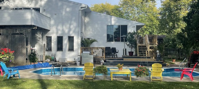 Contemporary home in quiet neighborhood with pool & great back yard close to all