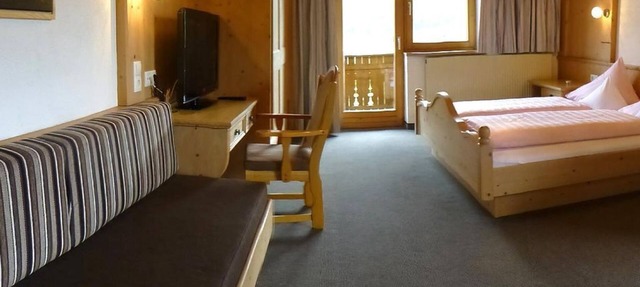 Habitación triple "Holzleiten" con sala de estar - Pension Alpenhof - Pensión de bienestar