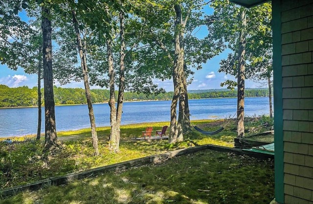 Cozy lakefront cabin with amazing views, deck, firepit, & water access